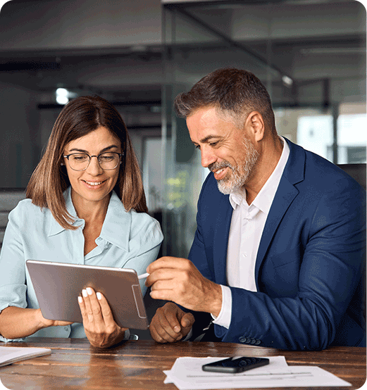 Business Professionals Collaborating On Digital Transformation Strategy Using A Tablet