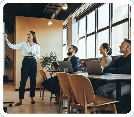 A Team Engaged in a Presentation on Salesforce Support Solutions in a Modern Conference Room