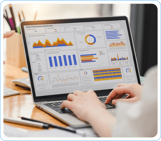 Person Analyzing Sales Performance Reports and Dashboards on Laptop at a Workspace