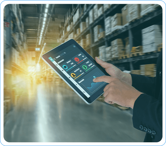 Person Using Tablet For Retail Analytics In A Large Warehouse, Monitoring Inventory And Performance Metrics